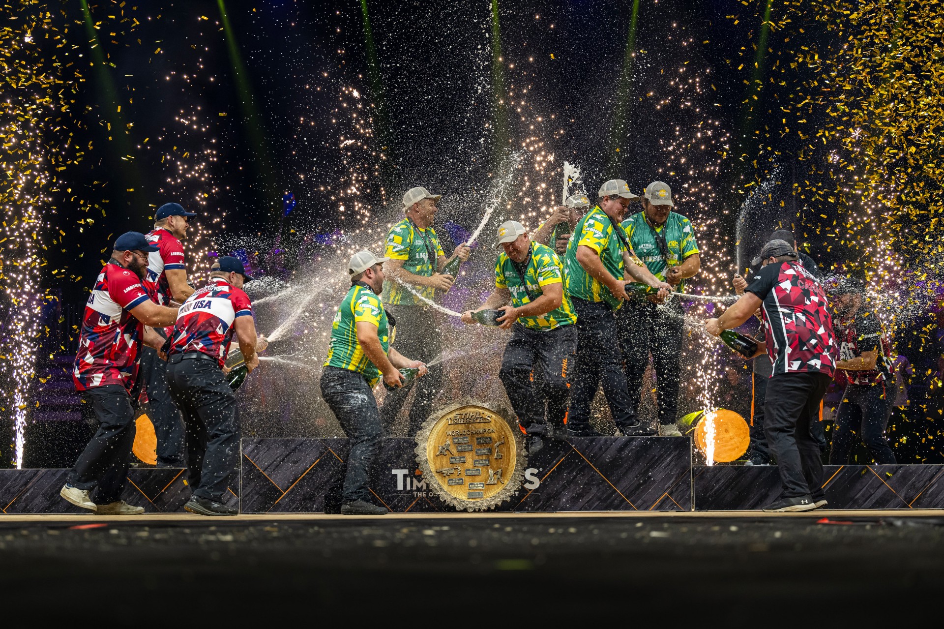 Podium finishers Australia, USA and Canada celebrate their achievement with the customary champagne shower.